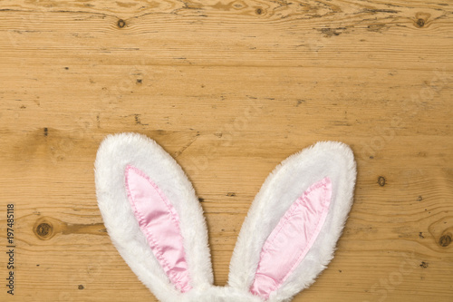 Easter bunny ears on a wooden background