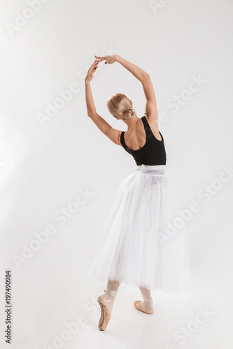 Full-lenght portrait of talented young woman ballerina