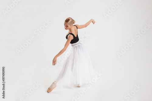 Full-lenght portrait of talented young woman ballerina