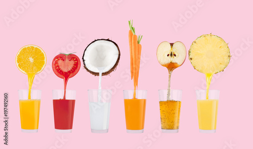 Fruit juices flowing from fresh fruits into the glass