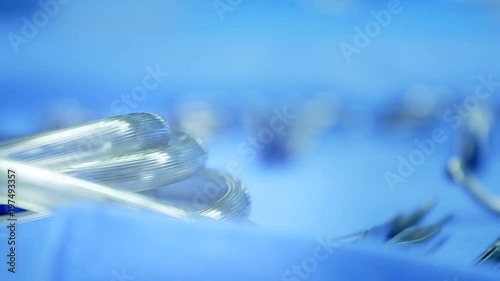 Hospital surgery tools - close ups. 3 surgery tools on a sterile table photo