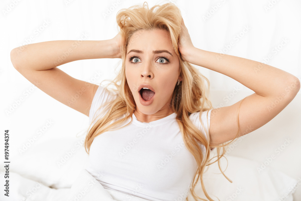 Portrait of a shocked young woman screaming Portrait of a shocked young woman screaming