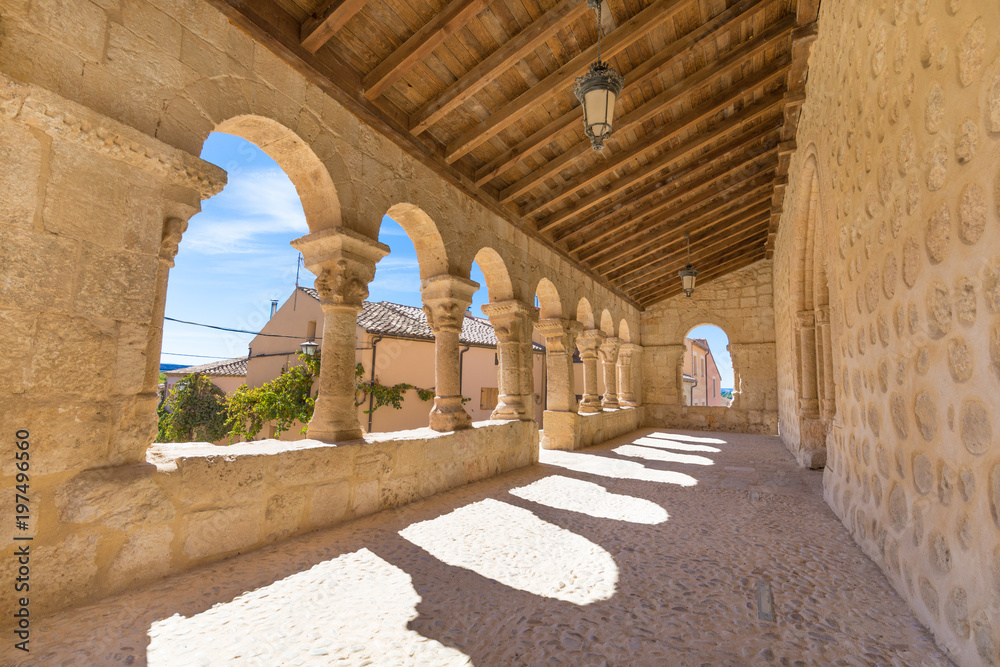 Fototapeta premium portico gallery in church San Miguel (Saint Michael), romanesque style landmark and public monument from eleventh century, in San Esteban de Gormaz, Soria, Spain, Europe