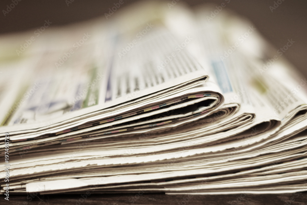 Bunch of newspapers folded and stack in a pile, concept for news. Paper background Bunch of newspapers folded and stack in a pile, concept for news. Paper background