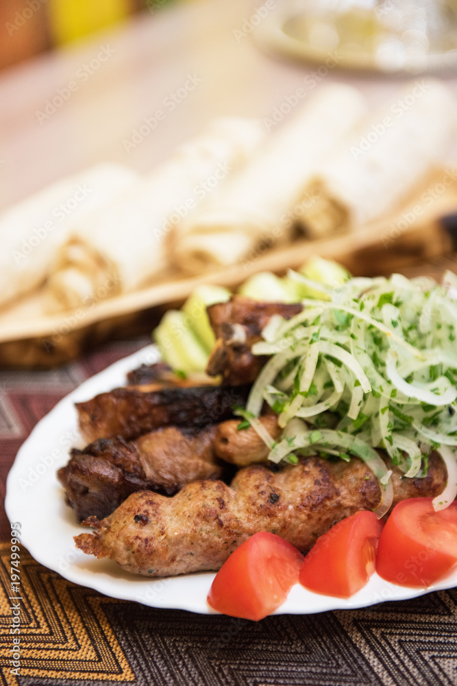 Grilled shish kebab or shashlik meat with vegetables