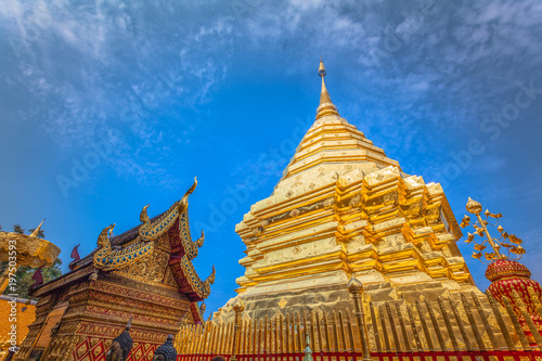 golden pagoda in wat Phrathat Doi Suthep under blue sky.Temple is tourist attraction of Chiang Mai  Thailand.