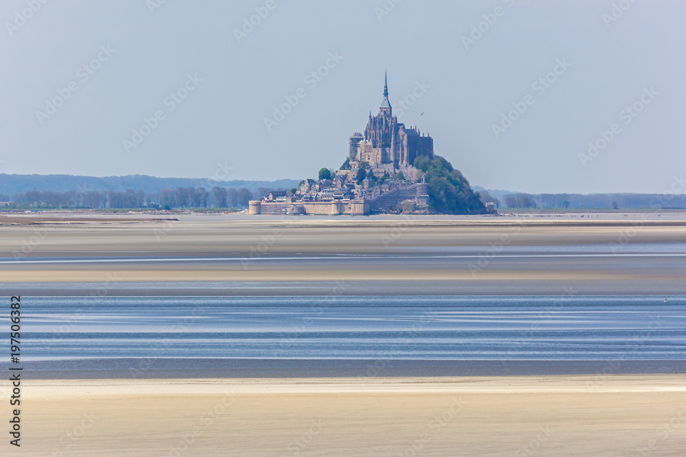 Beautiful view of the majestic Mont Saint Michel abbey at high tide in Normandy, France