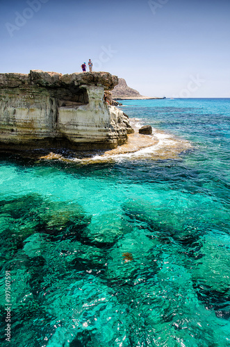 Sea caves of Cavo greco cape. Ayia napa, Cyprus with men