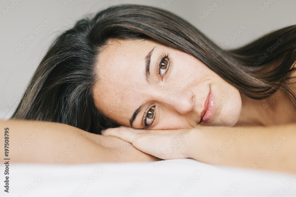 young beautiful woman resting on bed. Lifestyle at home. Indoors. Portrait young beautiful woman resting on bed. Lifestyle at home. Indoors. Portrait