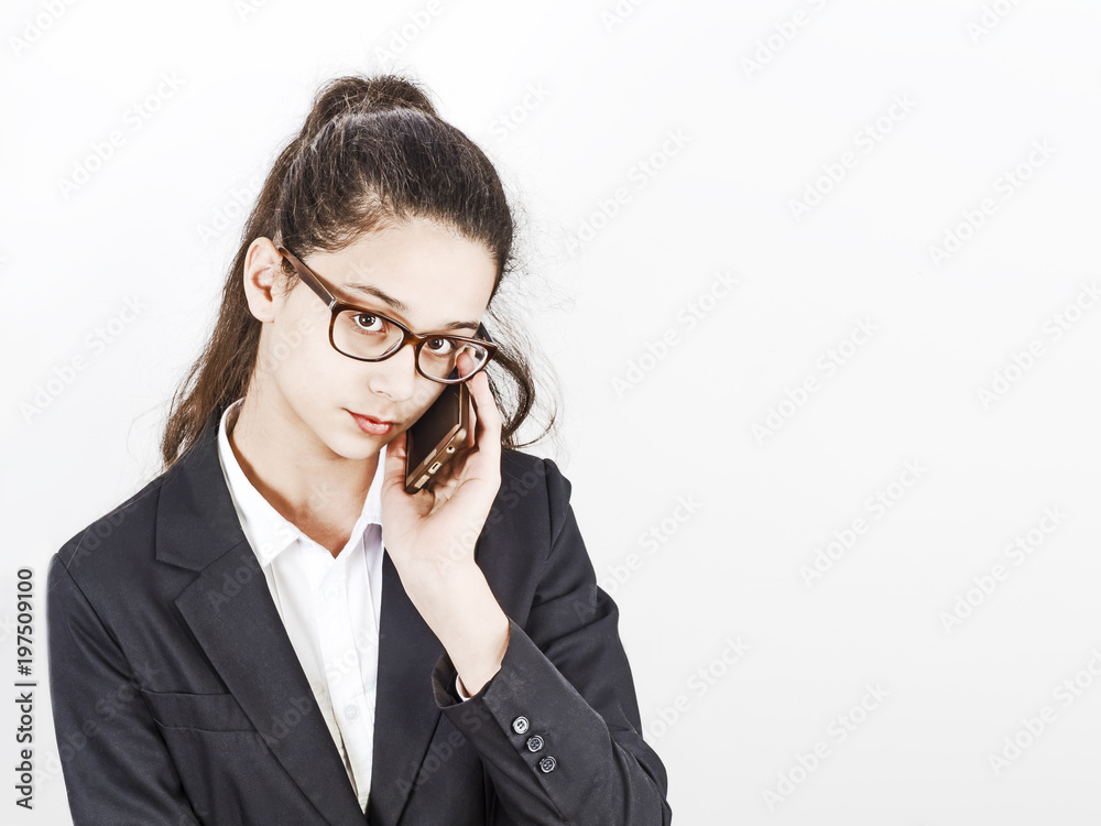 Businesswoman use of mobile phone, against a light background Businesswoman use of mobile phone, against a light background