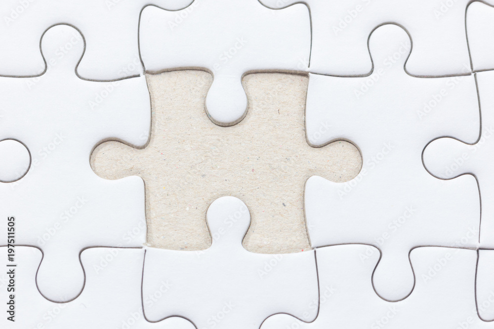 close up of White jigsaw puzzle with missed piece close up of White jigsaw puzzle with missed piece