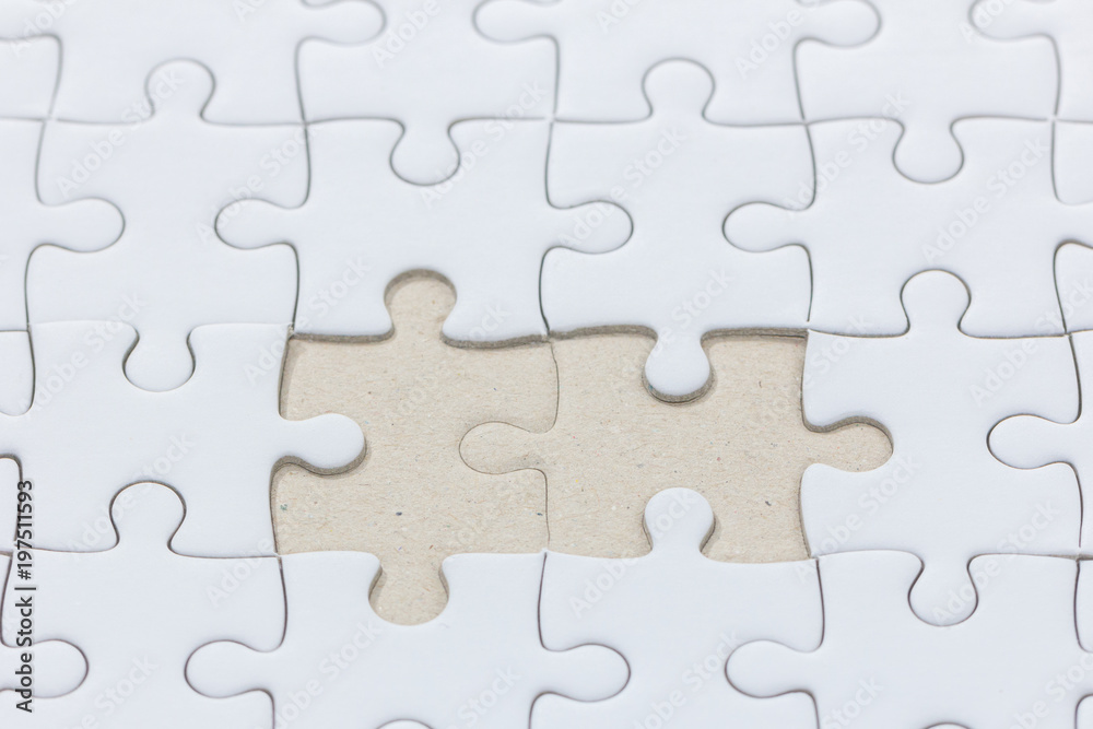 close up of White jigsaw puzzle with missed piece close up of White jigsaw puzzle with missed piece