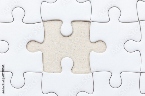 close up of White jigsaw puzzle with missed piece © moxumbic