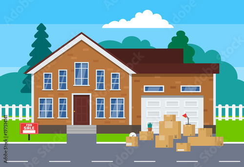 moving day concept.cardoard boxes near house for sale