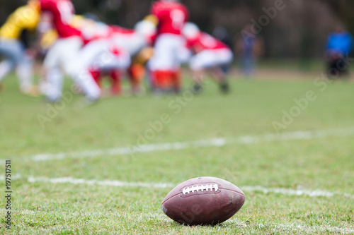 american football on the field - defocused players in the background