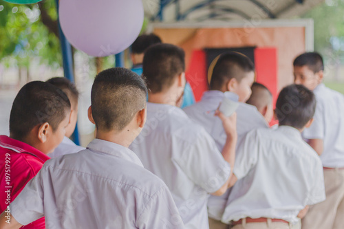 students Throw darts for skill test.