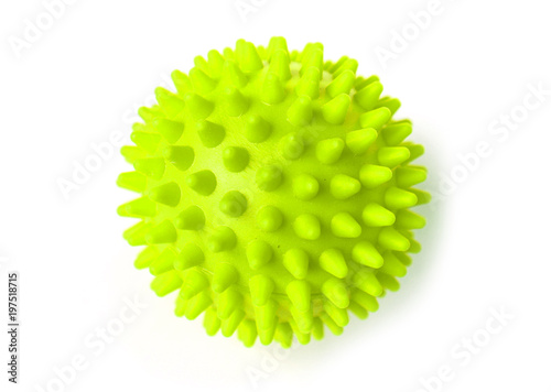 Green colorful bright isolated spiky ball toy, macro
