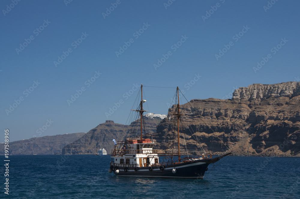 Sailing near caldera at Santorini island in Greece