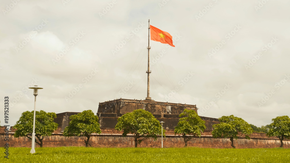 Imperial Royal Palace of Nguyen dynasty in Hue and fkag. Vietnam.