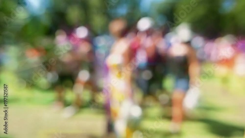Wallpaper Mural Seamless loop of defocused colorful crowd in slow motion at a festival. Filmed out-of-focus, with a lens flare effect, so the people are unrecognizable. Torontodigital.ca