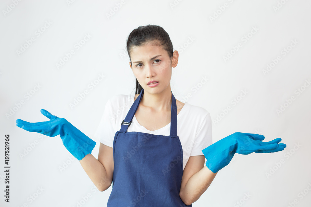 Protrait of Female cleaner with unhappy emotion on white background. House cleaning service concept. Protrait of Female cleaner with unhappy emotion on white background. House cleaning service concept.