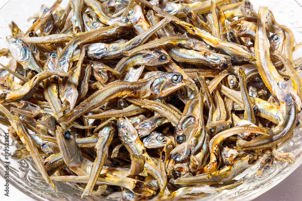 Close up of dried sardines used as seasoning in Japanese foods and cooking. Japanese healthy snack food. Niboshi or Iriko fish.