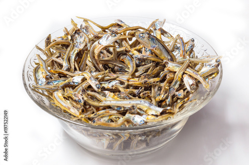 Close up of Japanese dried infant sardine used as seasoning in Japanese foods and cooking. Japanese healthy snack food. Niboshi or Iriko fish close up. photo