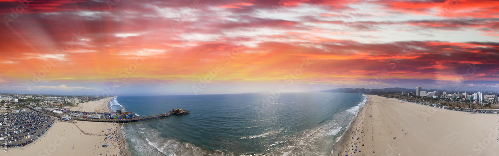 Fototapeta premium Aerial panoramic view of Santa Monica coastline and pier at dusk, CA