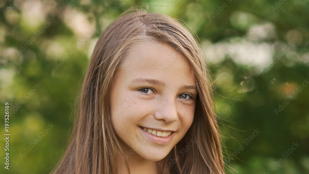 Girl teenager face close-up with freckles and funny posing embarrassed and playing with his hair. Girl teenager face close-up with freckles and funny posing embarrassed and playing with his hair.