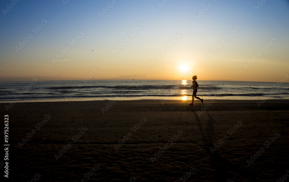 running on the beach sunrise 