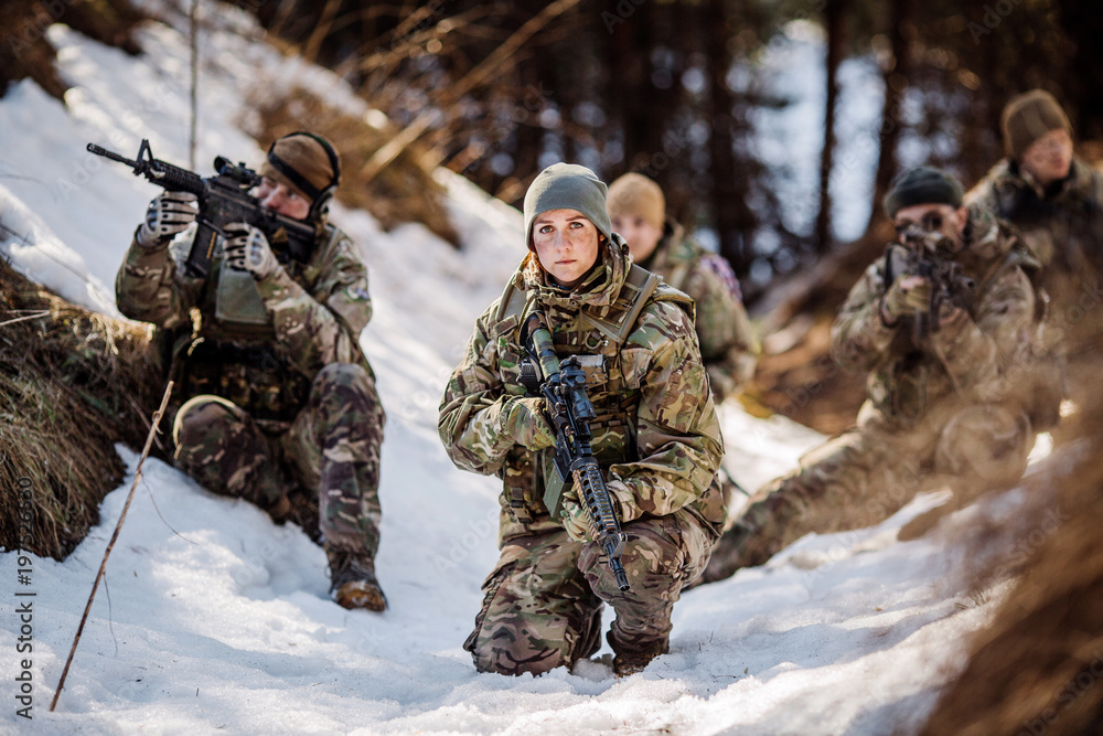 team of special forces weapons in cold forest. Winter warfare and military concept team of special forces weapons in cold forest. Winter warfare and military concept