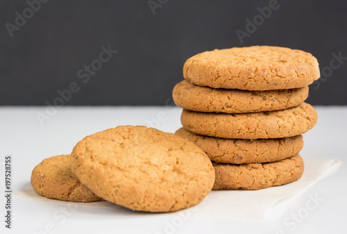 Stack of oatmeal cookies. Homemade gingerbread on table. Healthy Food Snack Concept. photo