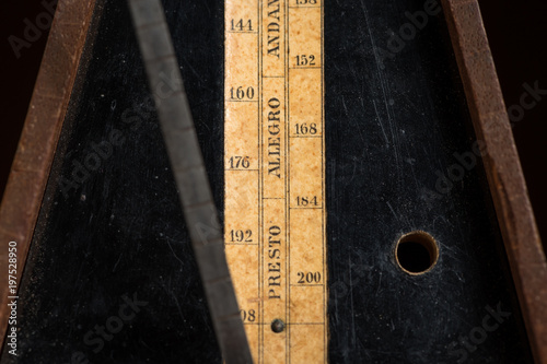 Detail of an old mechanic musical metronome photo