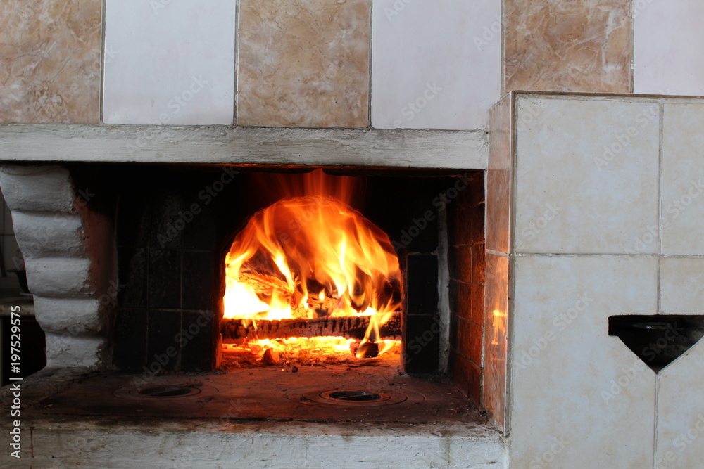 Hot,beautiful fire in the Russian stove,fireplace. Hot,beautiful fire in the Russian stove,fireplace.
