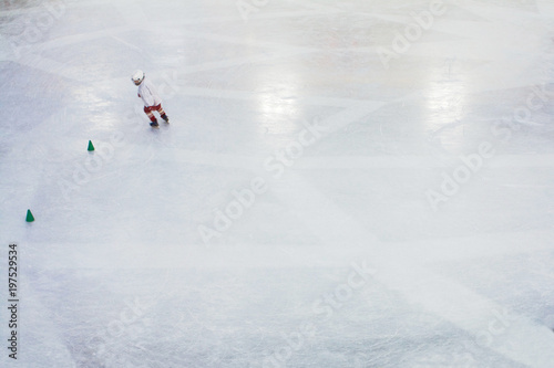 boy in hockey gear on the ice
