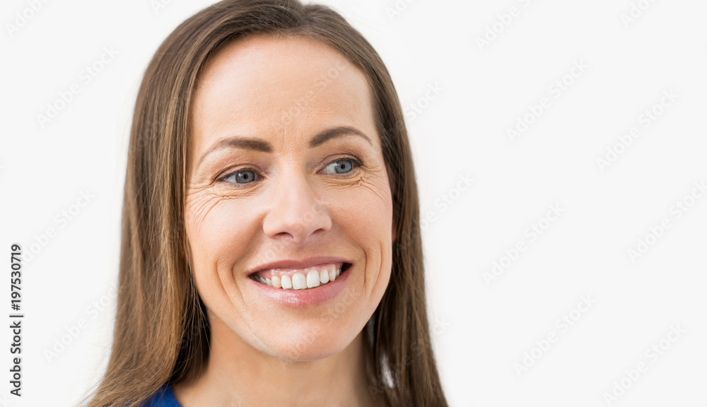 health and beauty concept - face of happy smiling middle aged woman health and beauty concept - face of happy smiling middle aged woman