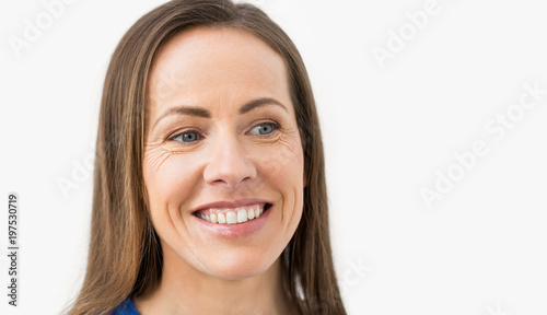 health and beauty concept - face of happy smiling middle aged woman