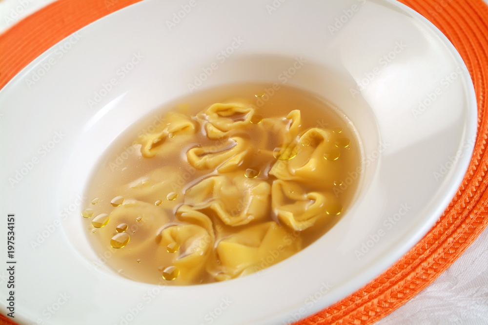 Italian food recipe, Tortelli in broth.