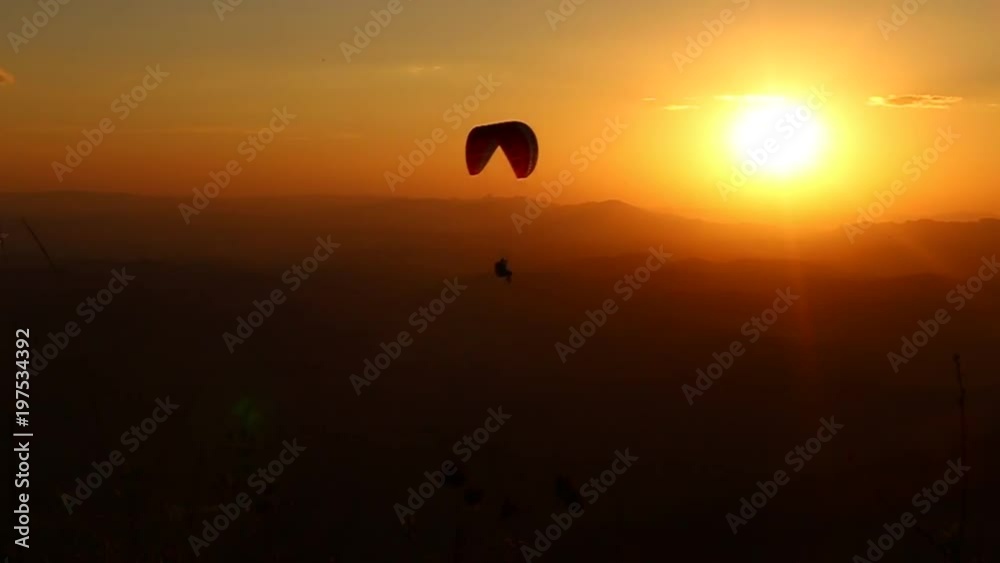 paragliding with beautiful sunset background paragliding with beautiful sunset background