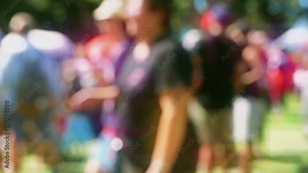 Seamless loop of defocused colorful crowd in slow motion at a festival. Filmed out-of-focus, with a lens flare effect, so the people are unrecognizable. Seamless loop of defocused colorful crowd in slow motion at a festival. Filmed out-of-focus, with a lens flare effect, so the people are unrecognizable.