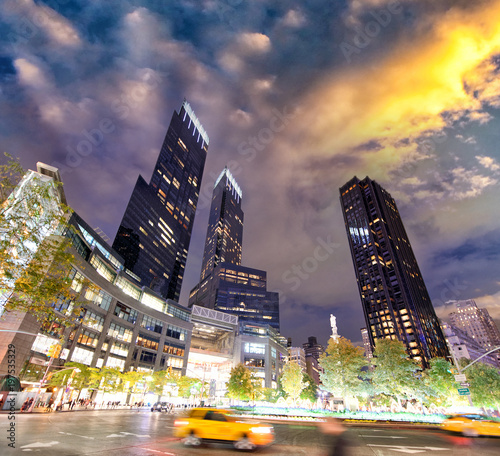 City streets and lights at night near Columbus Circle, New York photo