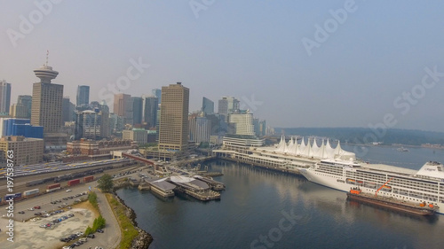 VANCOUVER, CANADA - AUGUST 9, 2017: Aerial view of city skyline from the port. Vancouver attracts 10 million tourists annually © jovannig