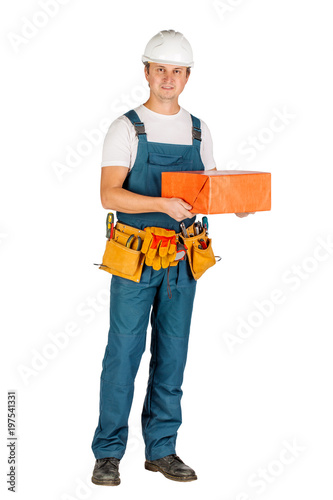 male builder or manual worker in helmet over white wall background. repair, construction, building, people and maintenance concept © kaninstudio