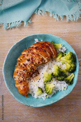 Glased chicken breast, rice and broccoli as garnish. Chicken in balsamic vinegar and brown sugar sauce photo