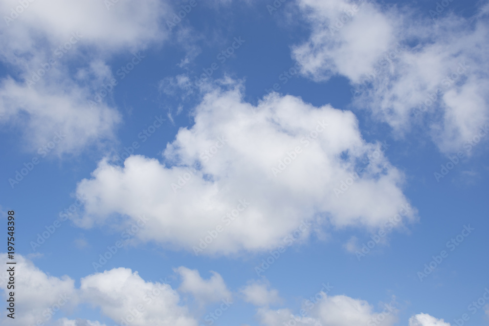 Beautiful puffy cumulus white clouds against blue sky Beautiful puffy cumulus white clouds against blue sky