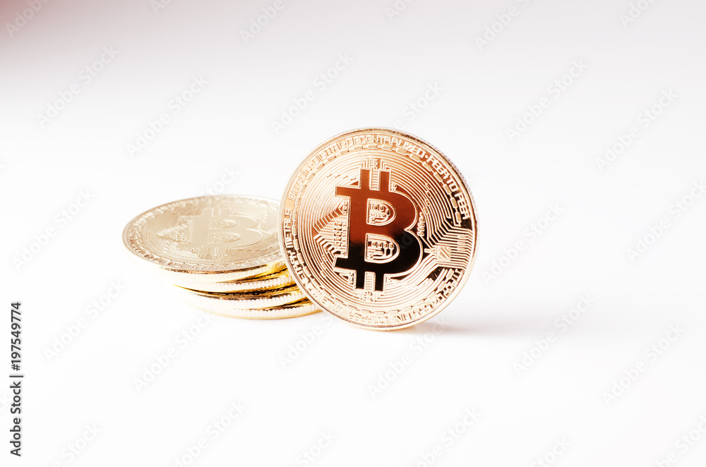 Physical Gold Bitcoin Coin on a white background. New worldwide cryptocurrency.