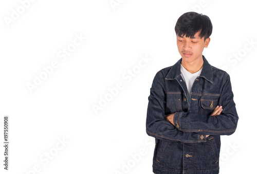 Canvas Print An armcroosing and sadden guy in jeans jacket.