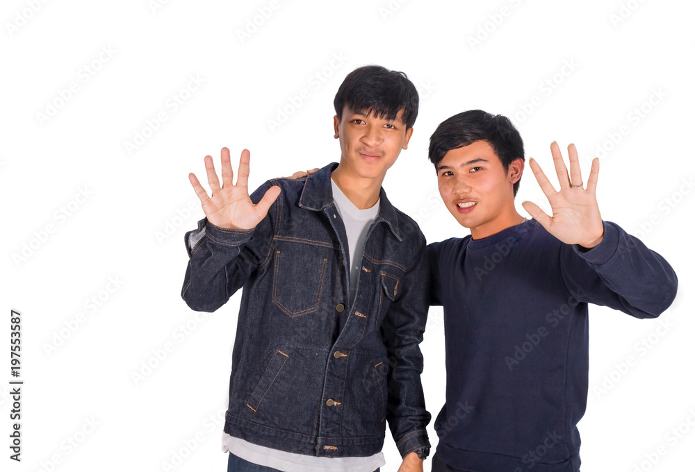 Two Thai boys show hand saying goodbye. Two Thai boys show hand saying goodbye.