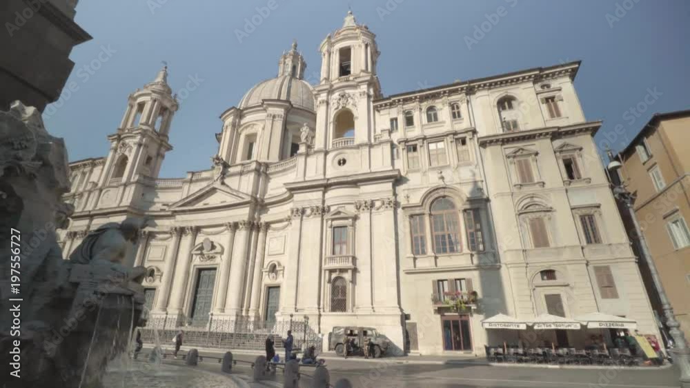 Wide angle panning shot across Piazza Navona and the Sant'Agnese in Agona cathedral in Rome Wide angle panning shot across Piazza Navona and the Sant'Agnese in Agona cathedral in Rome