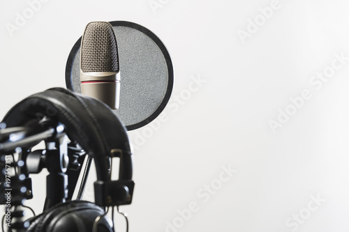 microphone and headphones in studio with white background